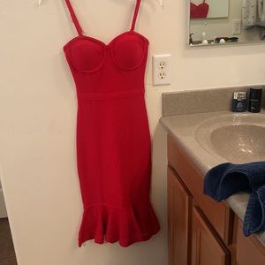 Strapless or with straps red Bebe flared at bottom knee length dress.